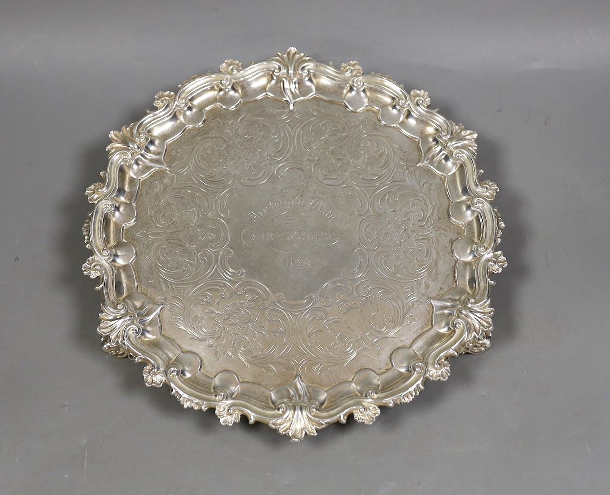 A Victorian engraved silver shaped circular salver, Edward & John Barnard, London, 1856, with engraved inscription, 25.5cm, 19oz.